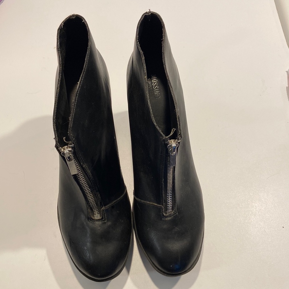 Rocker platform black boots. Size 11. Lightly worn, but shows some wear.